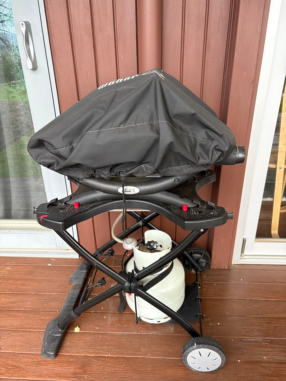 Weber Baby Q on stand with cover