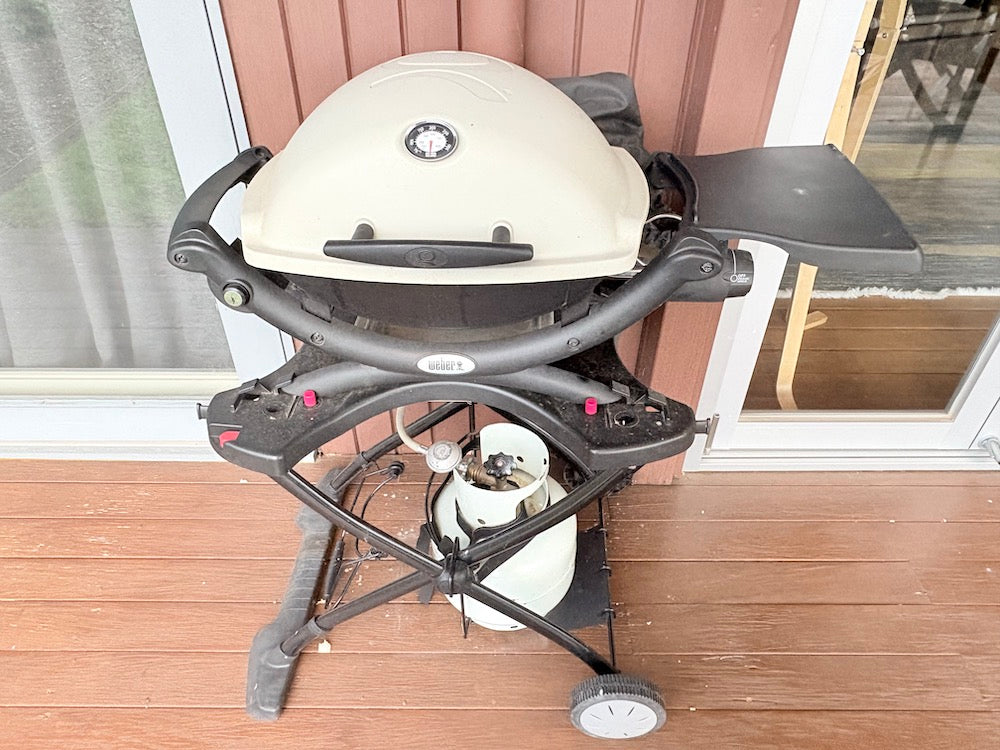 Weber Baby Q on stand with cover