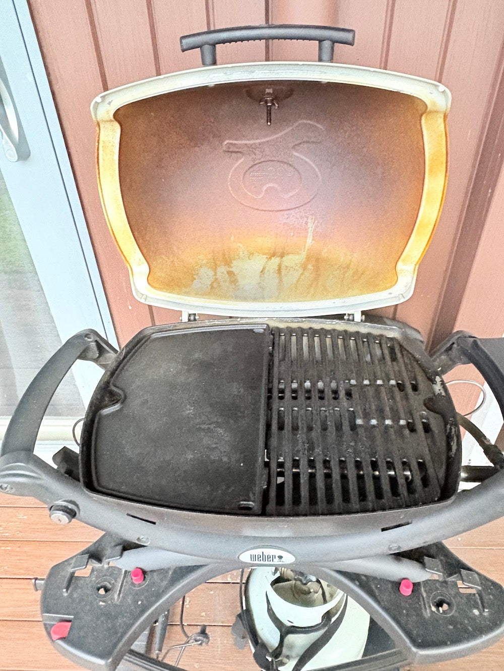 Weber Baby Q on stand with cover