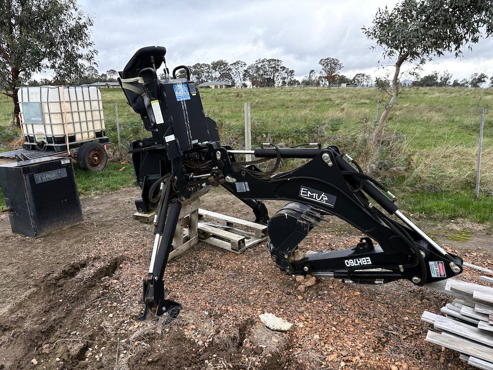 Emu 3-point linkage backhoe with buckets and ripper